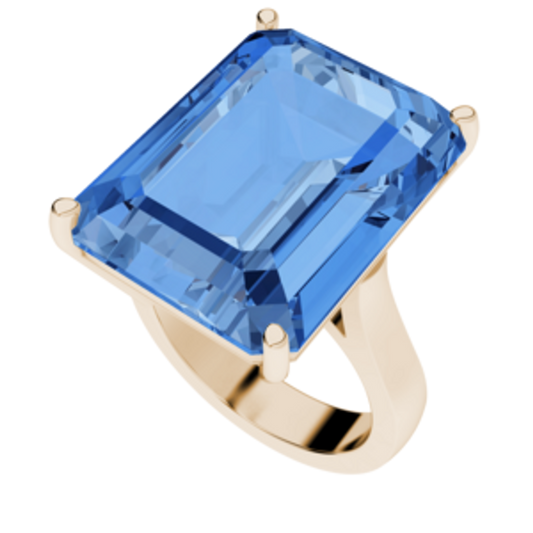 An emerald-cut rose gold ring with a large centerpiece gemstone, set on a sculpted band.